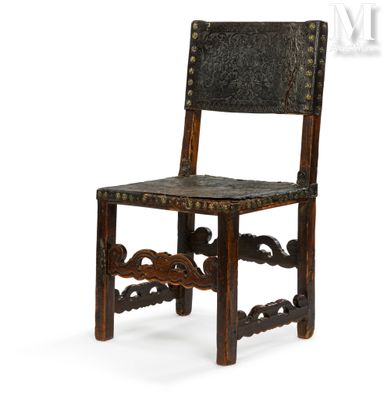 an old wooden chair with a leather seat on a white background