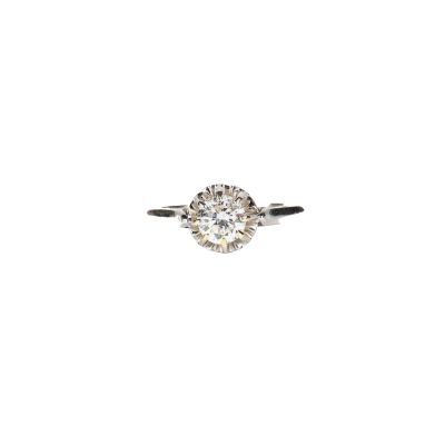 a close up of a diamond ring on a white background