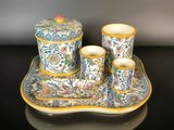 a picture of a table with a tray and cups on it