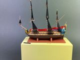 an image of a model of a sailing ship on a stand