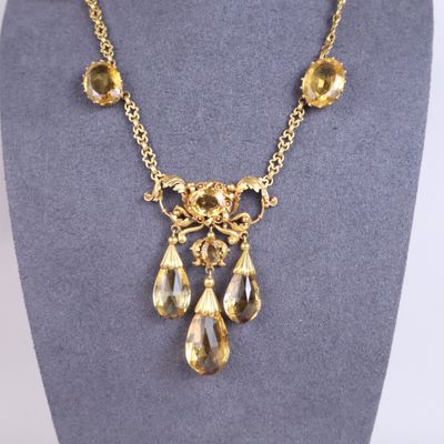 a close up of a necklace on a mannequin mannequin
