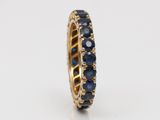 a gold ring with blue sapphires and diamonds