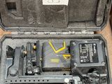 a tool in a case that is sitting on the floor