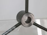 a close up of a metal object on a glass table
