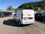 a white van that is parked in a parking lot