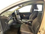 the interior of a car with the door open and the driver ' s seat down