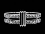 a close up of a diamond ring on a black background
