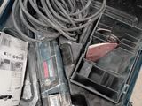 a tool box with a cord and other tools in it