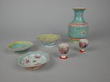 many different types of vases and bowls on the table