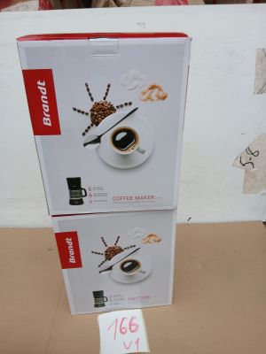 two boxes of coffee that have been placed on top of each other