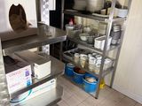 a kitchen with a lot of dishes on the shelves