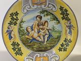 a plate with a picture of a woman and a child on it
