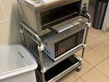 an image of a kitchen with a toaster oven and a trash can