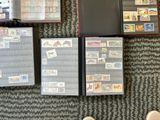 a person standing next to a collection of stamps on a carpet