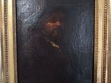 an oil painting of a man with a beard in a gold frame