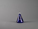 an image of a blue glass candle holder on a grey background