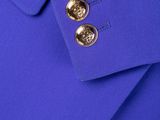 the jacket is blue and has gold buttons on it