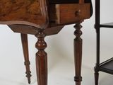 an old wooden table with a drawer on top of it