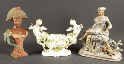 three figurines of women and a man on a horse and a bird