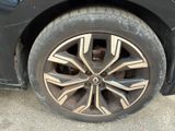 a close up of a tire on a black car