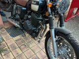 a motorcycle that is parked in front of a building