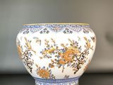 a white bowl with blue and yellow flowers on it