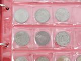 six different types of silver coins in a pink case