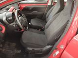 a red car with black seats and a steering wheel