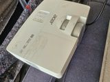 a remote control sitting on top of a bed