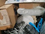 a basket full of assorted items in a room