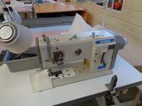 a sewing machine sitting on a table in a room