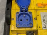 a yellow box with a blue lid and a blue outlet
