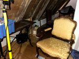 a camera and a tripod in the attic of a house