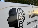 a van that has a logo on the side of it