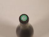 a close up of a bottle of beer on a table