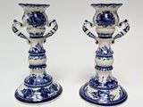 pair of blue and white candlesticks with floral designs