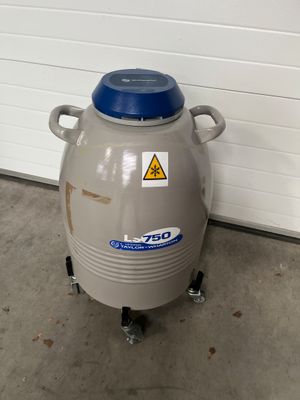 an image of a large gray container with a blue lid