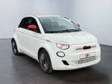 white car parked in a white room with a black floor