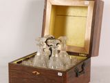 a wooden box with a set of wine glasses in it
