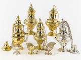 a lot of silver and gold items on a white surface