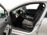 the interior of a car with the door open and the driver ' s seat down