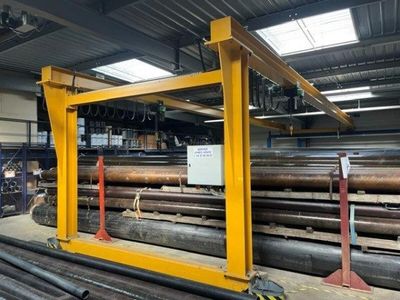 a picture of a warehouse filled with lots of steel pipes