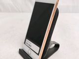 a cell phone that is sitting on top of a stand