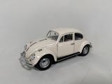a small toy car that is sitting on a white surface