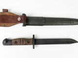 two knives are shown side by side on a white surface