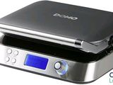 une image représentant une balance numérique sur laquelle est posé un téléphone portable