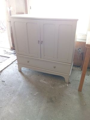 an image of a white cabinet in a room