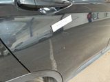 a car with a sticker on the side of it ' s door