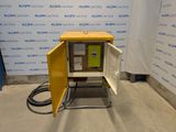 an image of a small yellow cabinet in a room