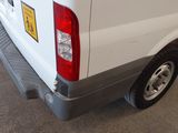 a white van that is parked in a garage